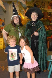 Julie Sherman poses with magic fans at the VIP Member Pre-Party event for Harry Potter.